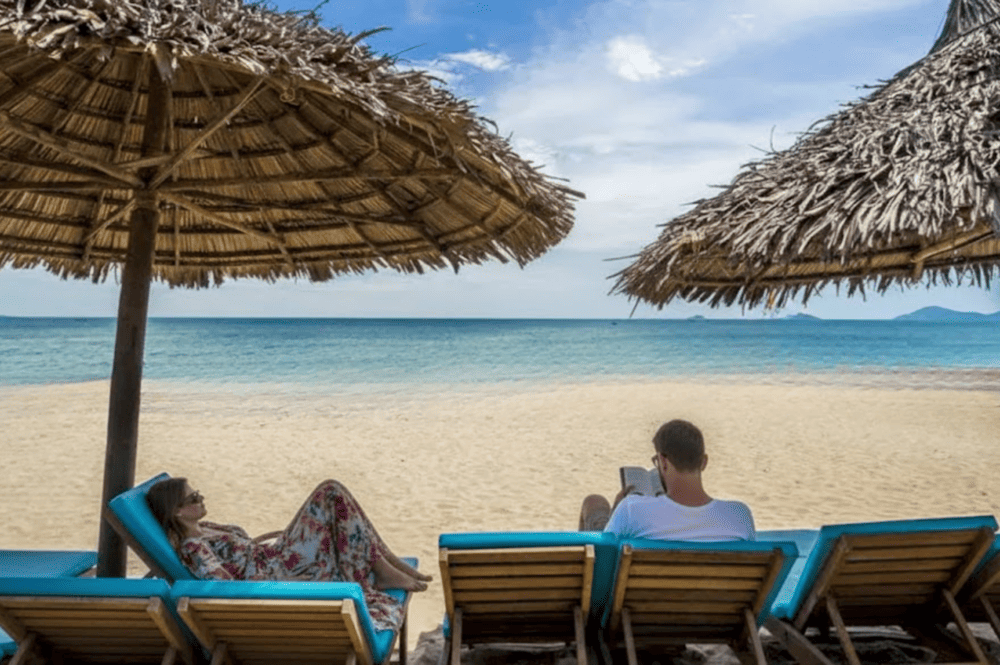 Serene waves, golden sands, and the gentle shade - An Bang Beach captured in its purest tranquility, where lounge chairs invite you to unwind by the shore